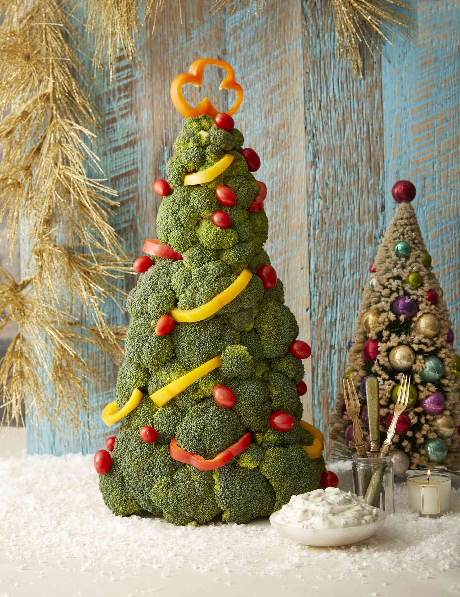 An edible Christmas tree made with broccoli and bell peppers