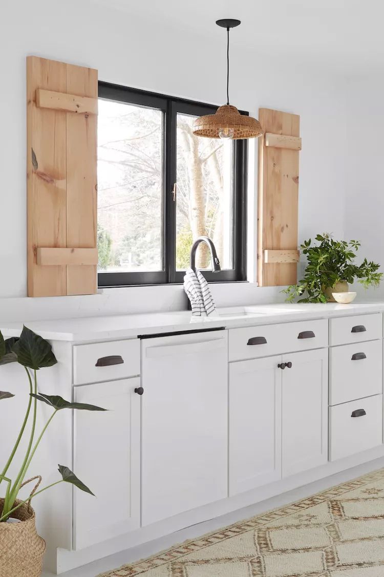 kitchen sink window with wooden shutters