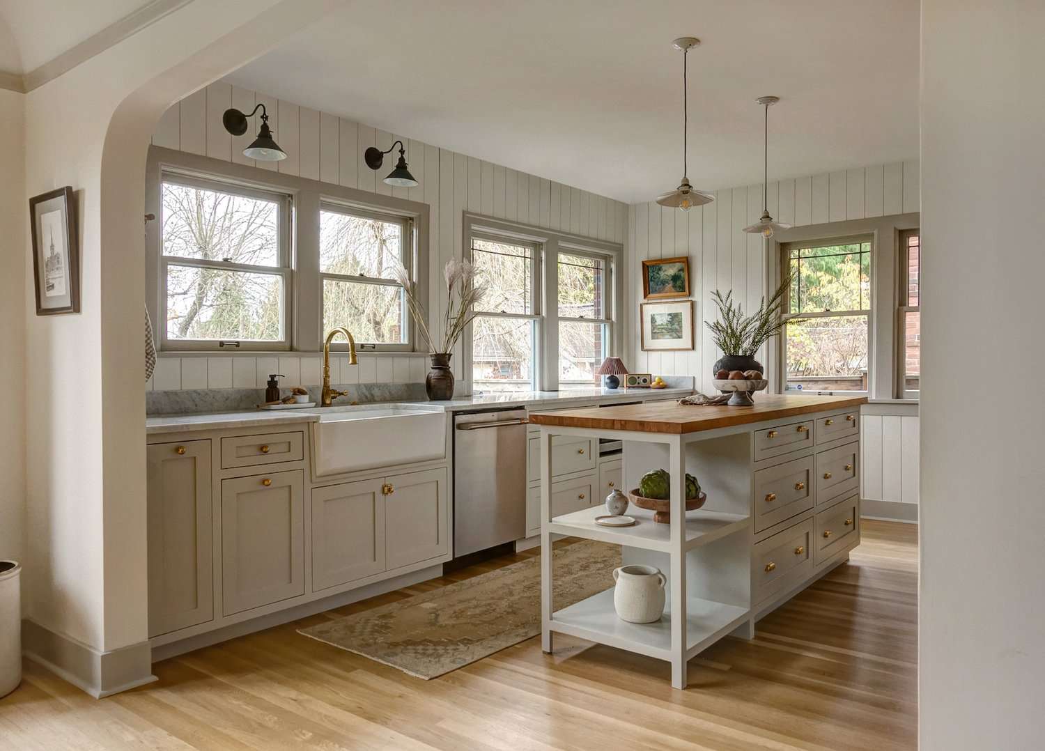 sconces above kitchen sink window