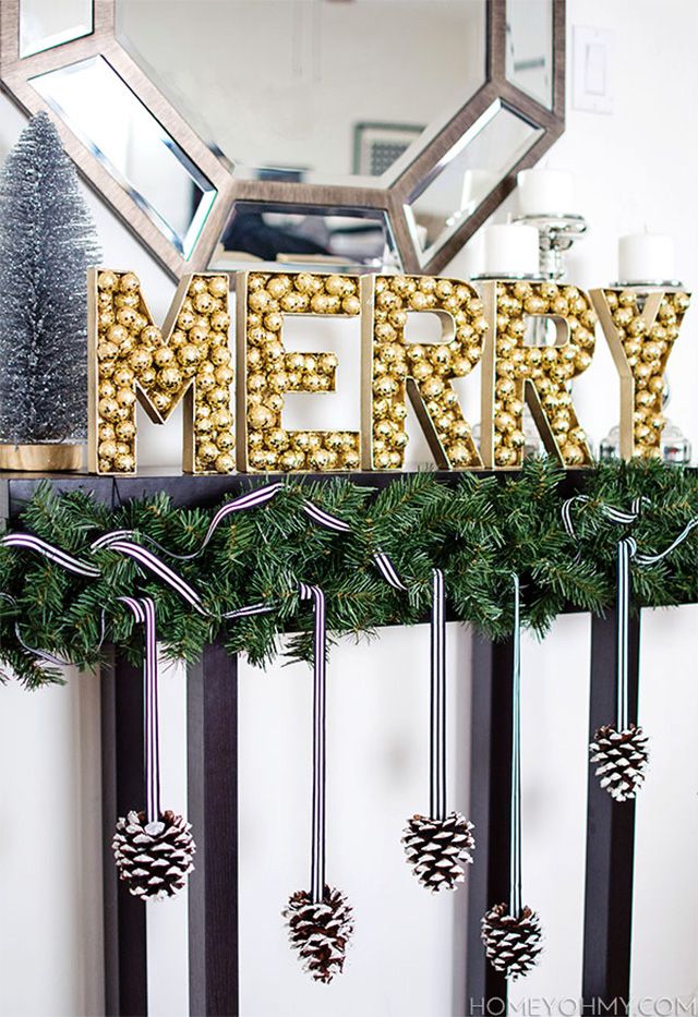 A DIY Christmas sign with gold glitter balls