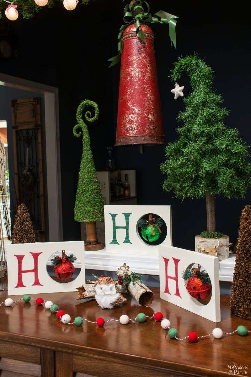 Several DIY Christmas signs on a table