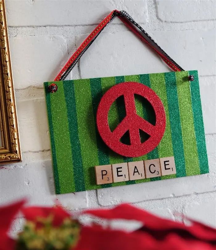 A DIY Christmas sign with red and green glitter